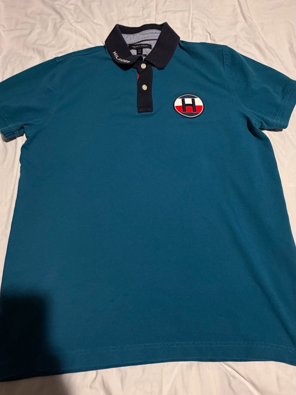 Tommy Hilfiger Men’s Teal Polo with Black Collar and Red-White Logo Patch